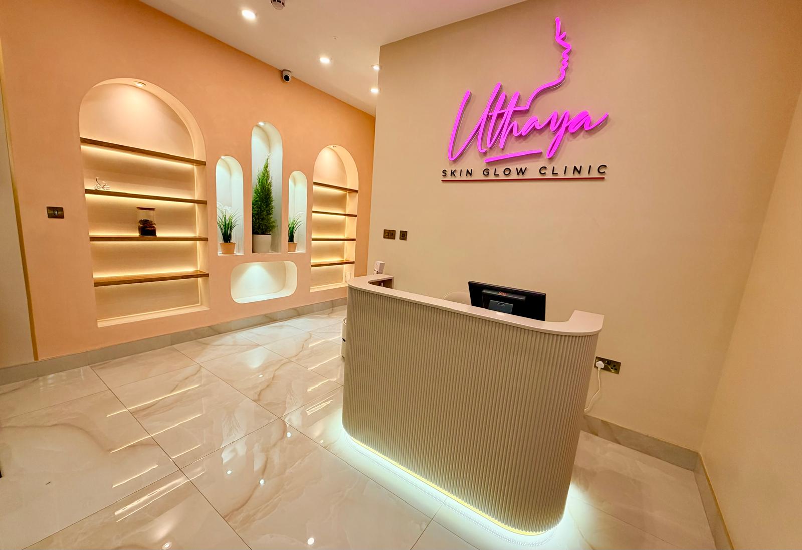 Uthaya Skin Glow Clinic reception desk and lit display shelving in East Ham